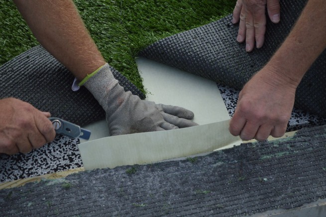 Huntsville artificial turf installation - cushion pad installation